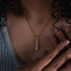 Elegant gold necklace with three vertical rectangular zircons on a delicate chain