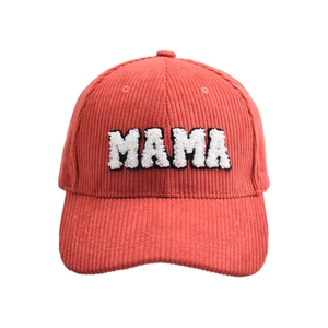 Close-up of pink corduroy baseball cap with white chenille MAMA letter embroidery