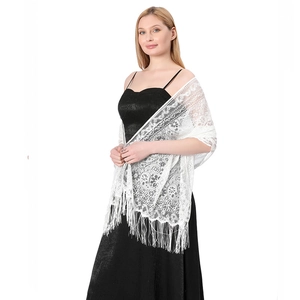 Detail of white hollow floral lace shawl featuring long fringe trim for formal wear