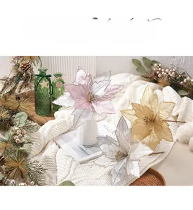 Close-up of shimmering 30cm artificial poinsettias in gold and silver for Christmas decor