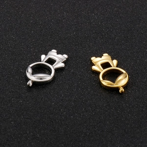 Detailed macro shot of silver and gold stainless steel hollow charm pendants for DIY jewelry