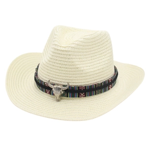 Straw cowboy hat in cream white featuring an ethnic band and silver bull head emblem