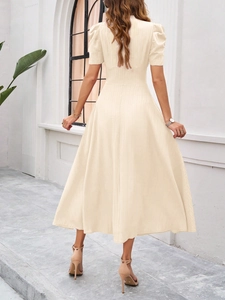 Rear view of an elegant beige A-line dress featuring puff sleeves and high waist design