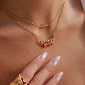 18K gold plated stainless steel Love letter and wing pendant necklaces on model