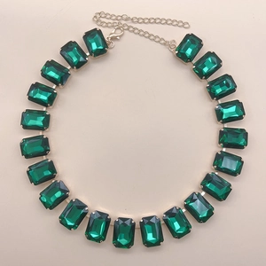 Detail of emerald cut green crystal necklace with gold plated chain and lobster clasp