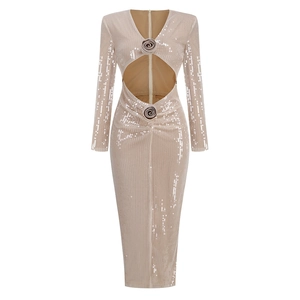 Close-up of champagne sequin dress featuring waist cut-out and 3D rose detail