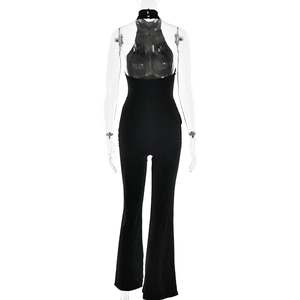 Back view of a black halter jumpsuit featuring backless design and flared leg details