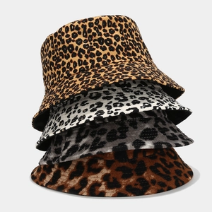 Detailed view of leopard print bucket hats in four distinct color combinations and textures