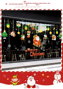 Close-up of Merry Christmas window stickers featuring Santa Claus and reindeer designs