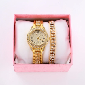 Close-up of a gold rhinestone watch and bracelet set in a luxury pink gift box