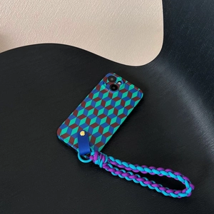 Macro shot of geometric phone case with blue and purple braided lanyard on a chair