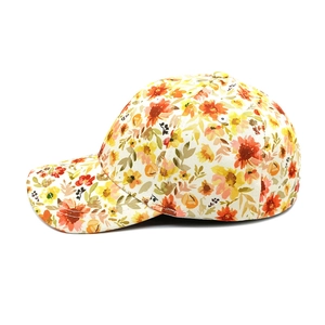 Side view detail of a vibrant floral baseball cap with colorful print and curved brim
