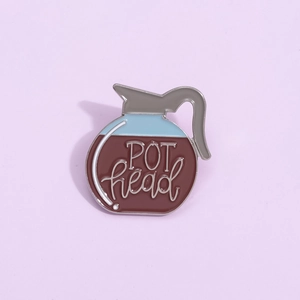 Coffee pot enamel pin with POT head lettering on a soft purple background