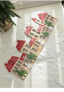 Wooden Christmas fence with house shapes, snowman and tree decorations for tree base