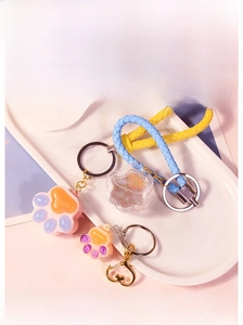 Detailed view of cat paw quicksand silicone molds with cute braided wrist straps