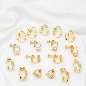 Macro view of 18K gold plated earring converters in screw and U-shaped clip-on styles