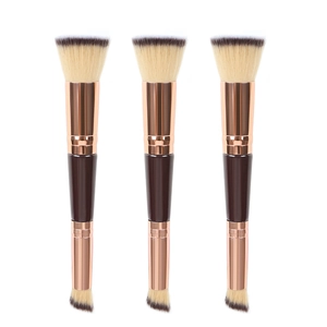 Professional dual-ended foundation brush with flat and angled heads in rose gold finish