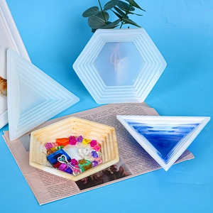 Detail of geometric silicone tray molds for resin with triangle and hexagon finished crafts