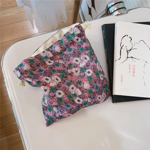 Close-up of vintage oil painting style floral cotton drawstring pouch with neat stitching