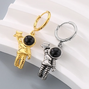 Astronaut stainless steel hoop earrings in gold and silver finish on white display