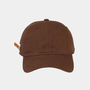 Detail of dark brown cotton baseball cap with vintage leather strap and woven label tag