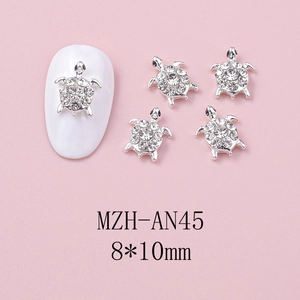 Detail of silver turtle nail art charm with sparkling crystals and size 8x10mm