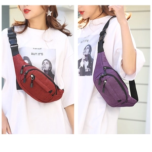 Detail view of burgundy and purple waist bags showing three zippered compartments and texture