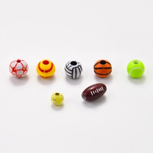 Macro detail of acrylic sports ball beads including football, basketball and baseball