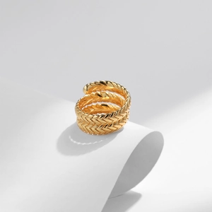 18K gold plated butterfly ring with zircon droplet and woven texture on white paper