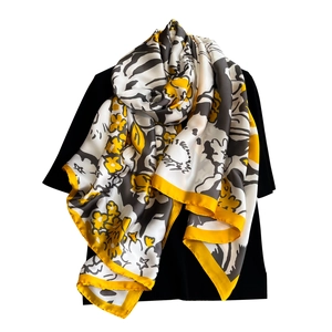 Elegant floral print long scarf with yellow and grey abstract patterns on black silk
