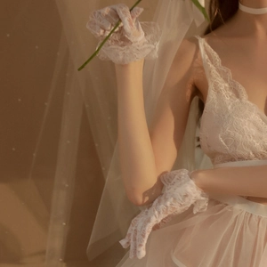 Elegant white floral lace gloves for weddings and photography shown on model