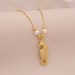 Exquisite gold seahorse pendant necklace with pearl accents and sparkling crystal inlays