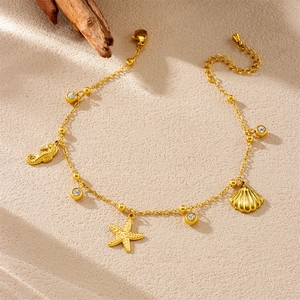 Gold stainless steel ocean anklet with starfish, seahorse and shell charms for women