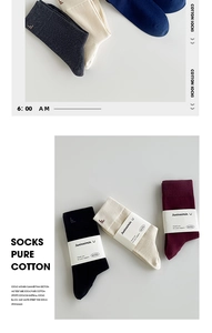 Close-up of premium cotton mid-calf socks showing knit texture and color options