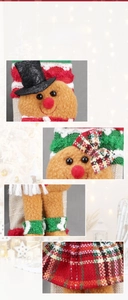 Detail of gingerbread man fridge handle cover with plaid bow and plush fabric texture