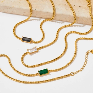 Gold necklaces set with black, white, and green rectangle zircon pendants on rope chains