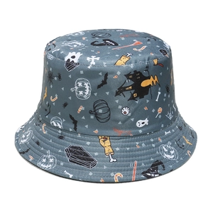 Detail showing the festive Halloween pumpkin and bat prints on the grey bucket hat