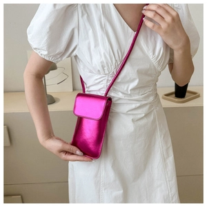 Vertical shiny fuchsia metallic PU leather crossbody bag for mobile phone on model