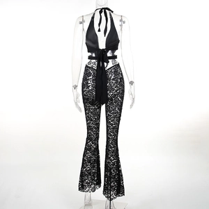 Back view of black lace halter neck jumpsuit with open back and flared leg design