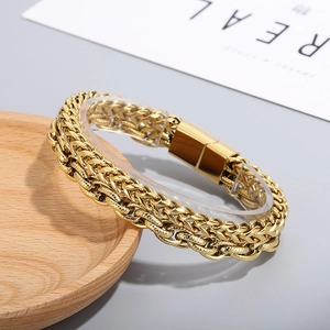 Detailed view of the double-layered gold braided wheat chain bracelet with magnetic clasp