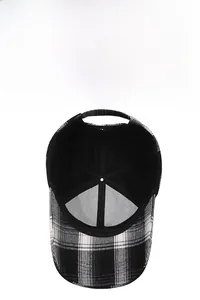 Detail view of the black and white plaid baseball cap showing inner mesh lining and stitching
