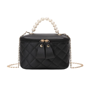 Quilted black mini bucket bag with pearl handle and gold chain strap for women