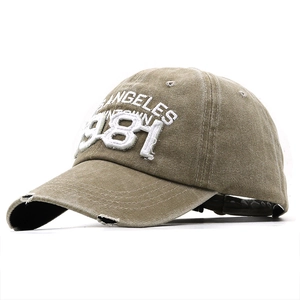 Close-up of 1981 3D embroidery on vintage washed cotton baseball cap with distressed edge
