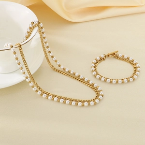 Set di collana e bracciale placcati oro 18K con perle d'acqua dolce su tessuto