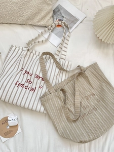Striped canvas tote bag with smiley face and letter embroidery for casual shopping