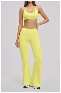 Macro detail of fluorescent yellow flared yoga pants with high waist and brushed texture