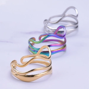 Minimalist adjustable wave rings for men and women in gold, silver, and iridescent steel