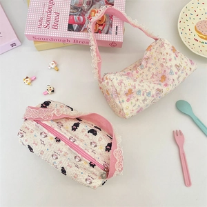 Detail of cartoon canvas tote bags featuring delicate lace trim and sweet bunny patterns