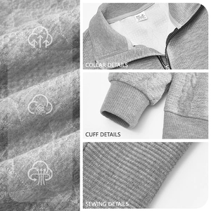 Retro grey stand collar zip pullover with textured knit stitching and ribbed cuffs