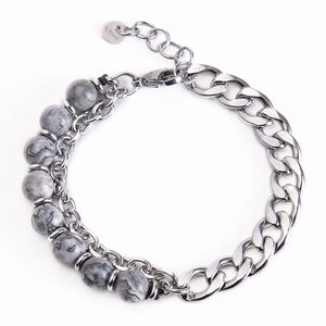 Detail of double-layer men's bracelet with silver stainless steel chain and natural grey stone beads